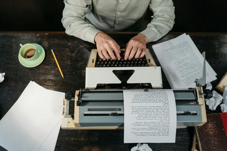A writer’s desk with a manuscript and red pen highlighting mistakes, symbolizing the process of avoiding common short story writing errors.